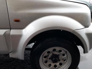 MODANATURA PARACOLPI PASSARUOTA ANT. DX. SUZUKI JIMNY «I» (1999) [it064013]