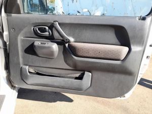PANNELLO RIVESTIMENTO PORTA ANT. DX. SUZUKI JIMNY «I» (1999) [it067140]